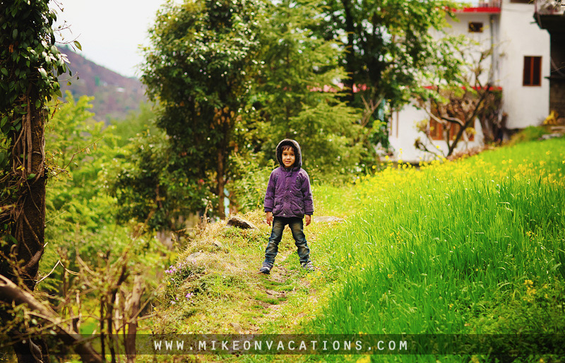 Child hiking trail Himalayas Bhagsu village travel with kids mountains