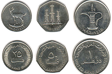 UAE dirham coins with Arabic numerals close-up Dubai currency