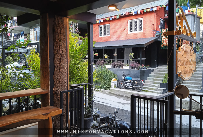 Vashisht street Manali village road houses hillside
