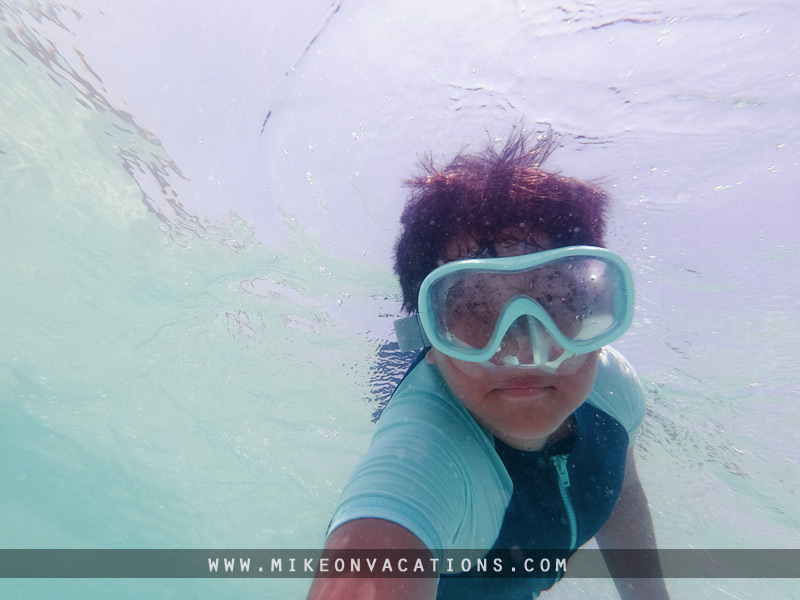 Swimming in Pattaya with kids Child swimming underwater in Pattaya sea